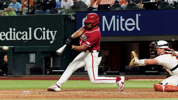 Kendal Diggs swings at a pitch against Texas pitcher Lucas Gordon in the season opener at Globe Life Field.